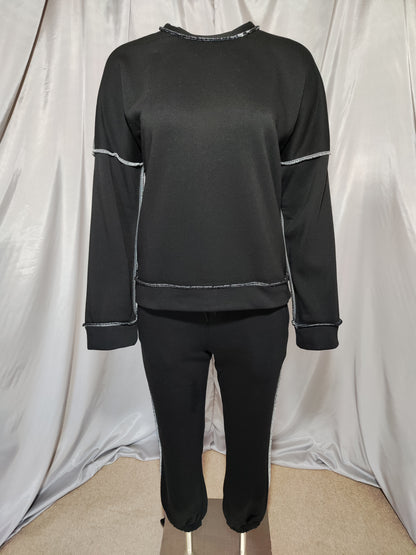 Crna trenirka s kontrastnim šavovima