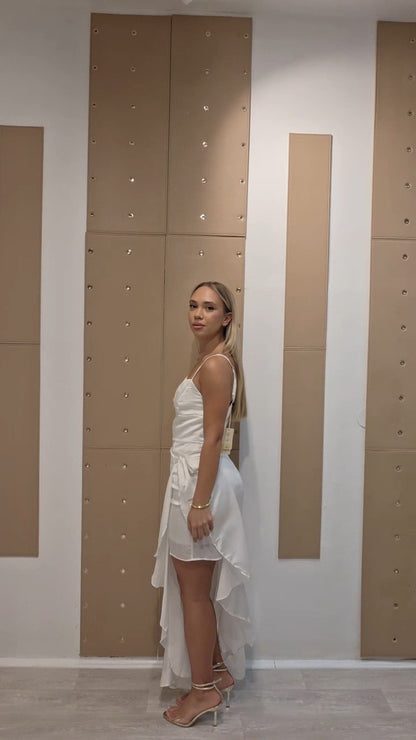 Bijela elegantna midi haljina s asimetričnim volanom